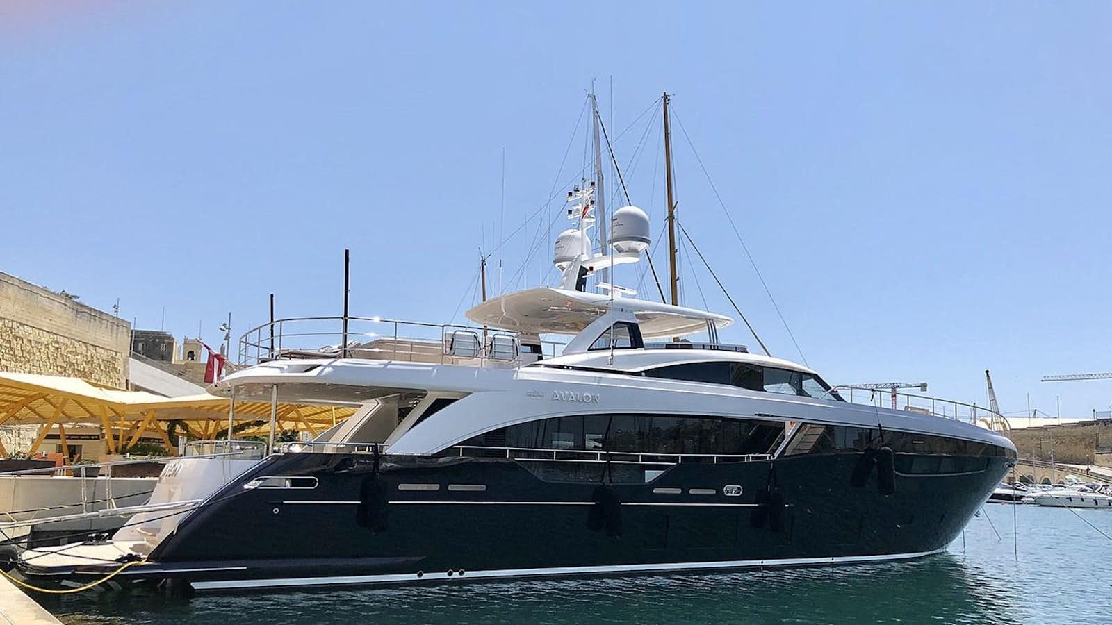 a boat docked in a harbor aboard AVALON Yacht for Sale
