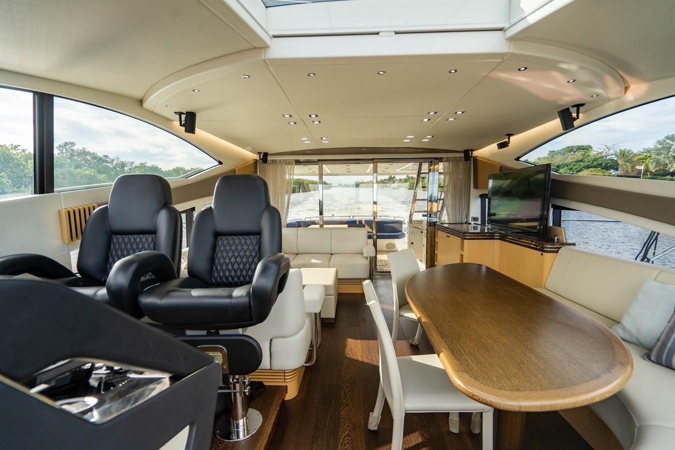 inside of a vehicle with a table and chairs and a large window aboard SUBMARINO Yacht for Sale
