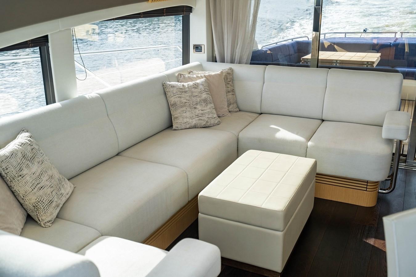a white couch with pillows aboard SUBMARINO Yacht for Sale