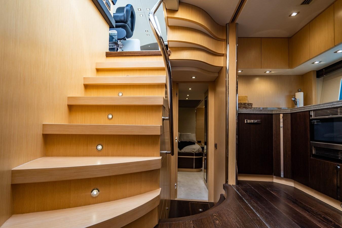 a kitchen with wooden cabinets aboard SUBMARINO Yacht for Sale