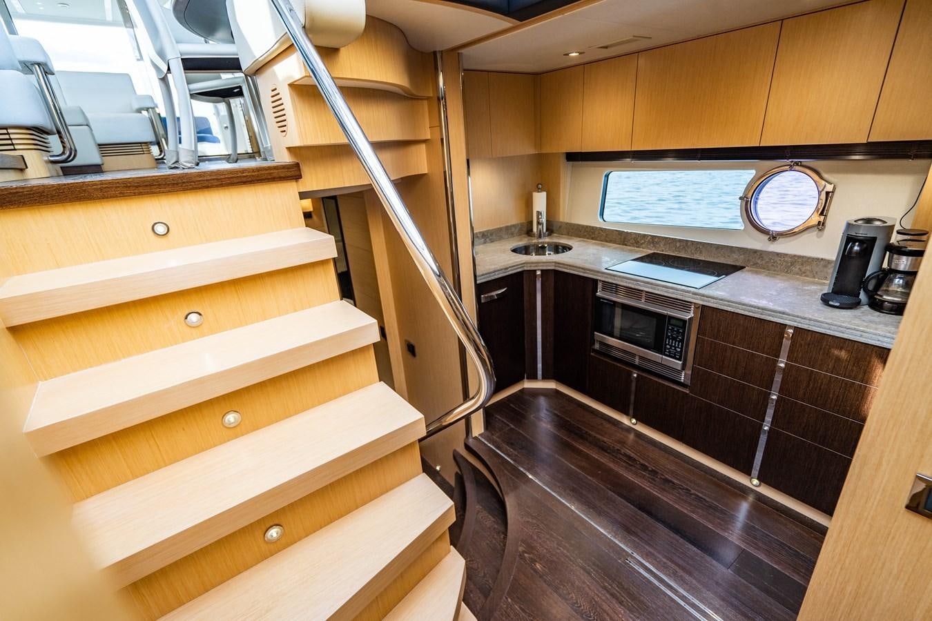 a kitchen with wooden cabinets aboard SUBMARINO Yacht for Sale