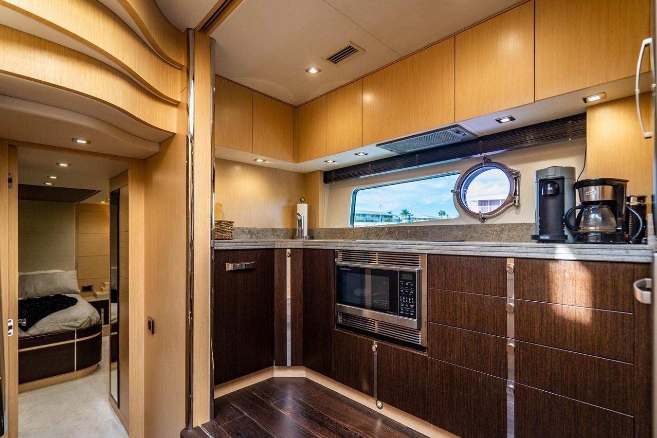 a kitchen with wooden cabinets aboard SUBMARINO Yacht for Sale
