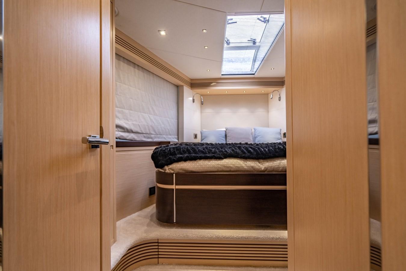 a room with a couch and a wood door aboard SUBMARINO Yacht for Sale