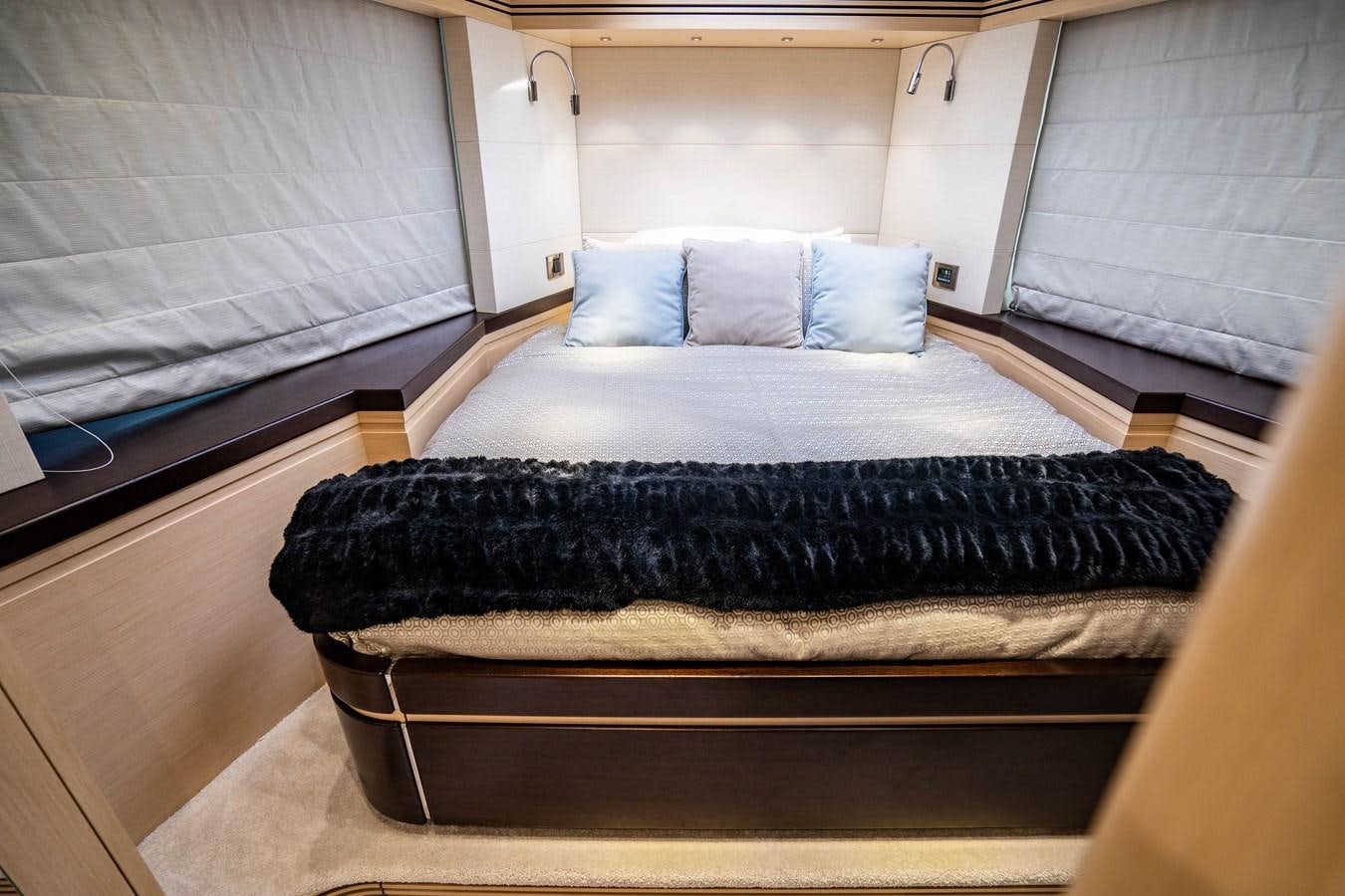 a bed with a black blanket aboard SUBMARINO Yacht for Sale