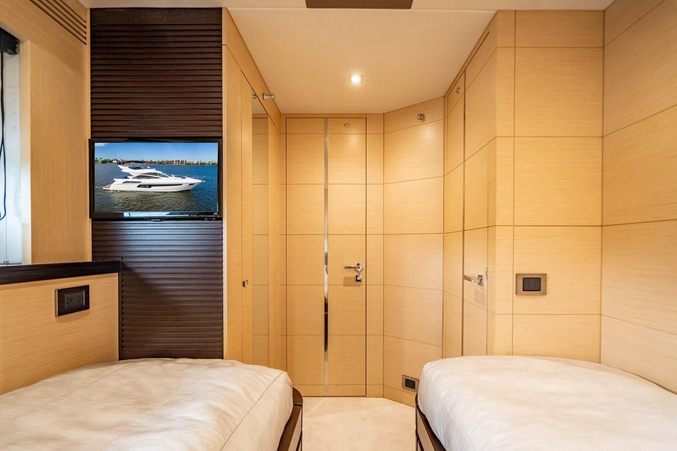 a room with a bed and a television aboard SUBMARINO Yacht for Sale