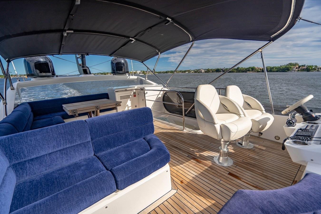 a boat with a chair and a sofa aboard SUBMARINO Yacht for Sale