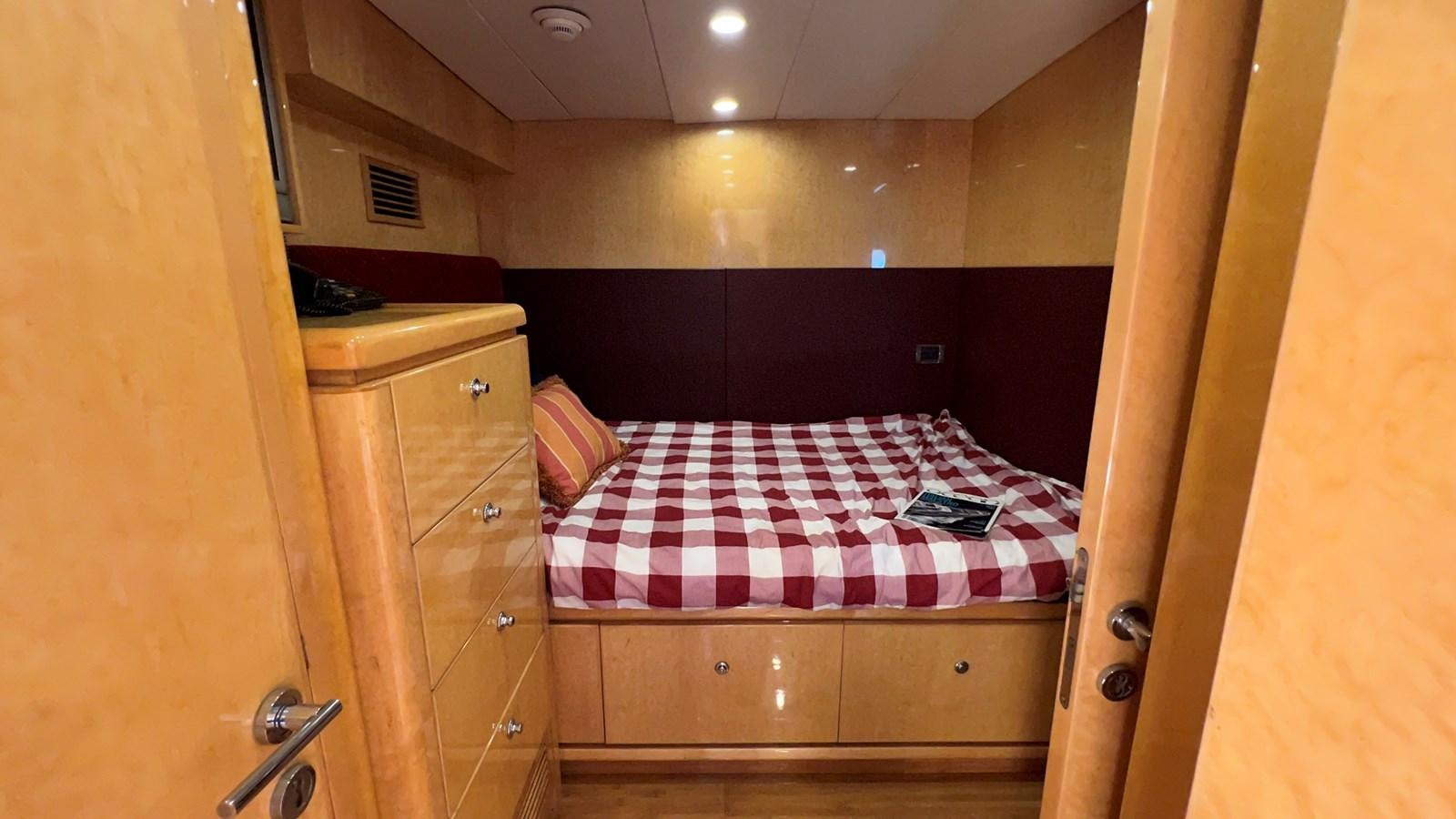 a bed in a room aboard MISSY B II Yacht for Sale