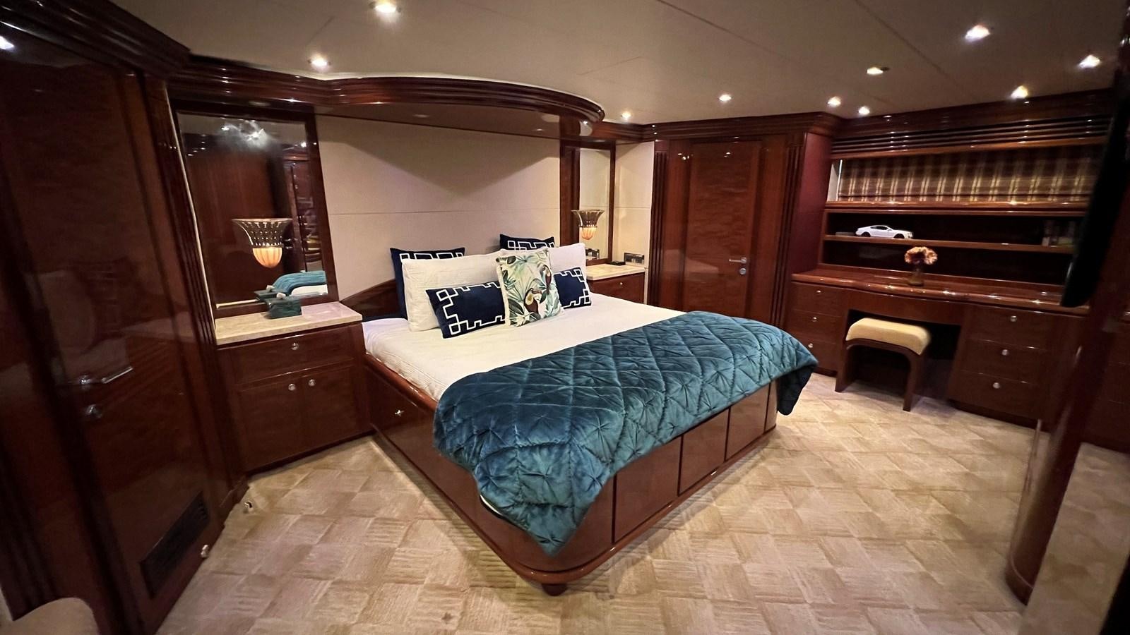a bed in a room aboard MISSY B II Yacht for Sale