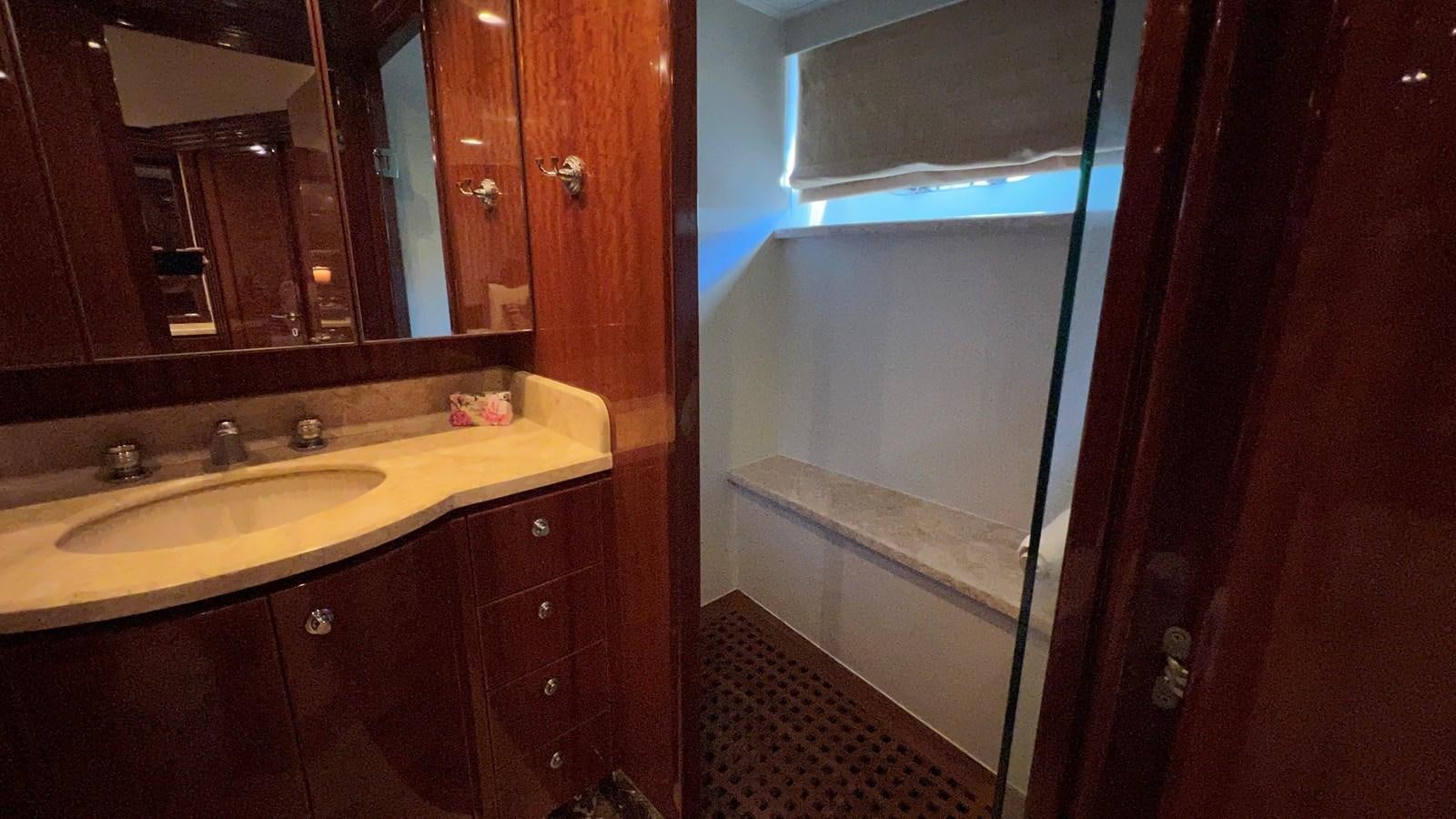 a bathroom with a sink and a mirror aboard MISSY B II Yacht for Sale