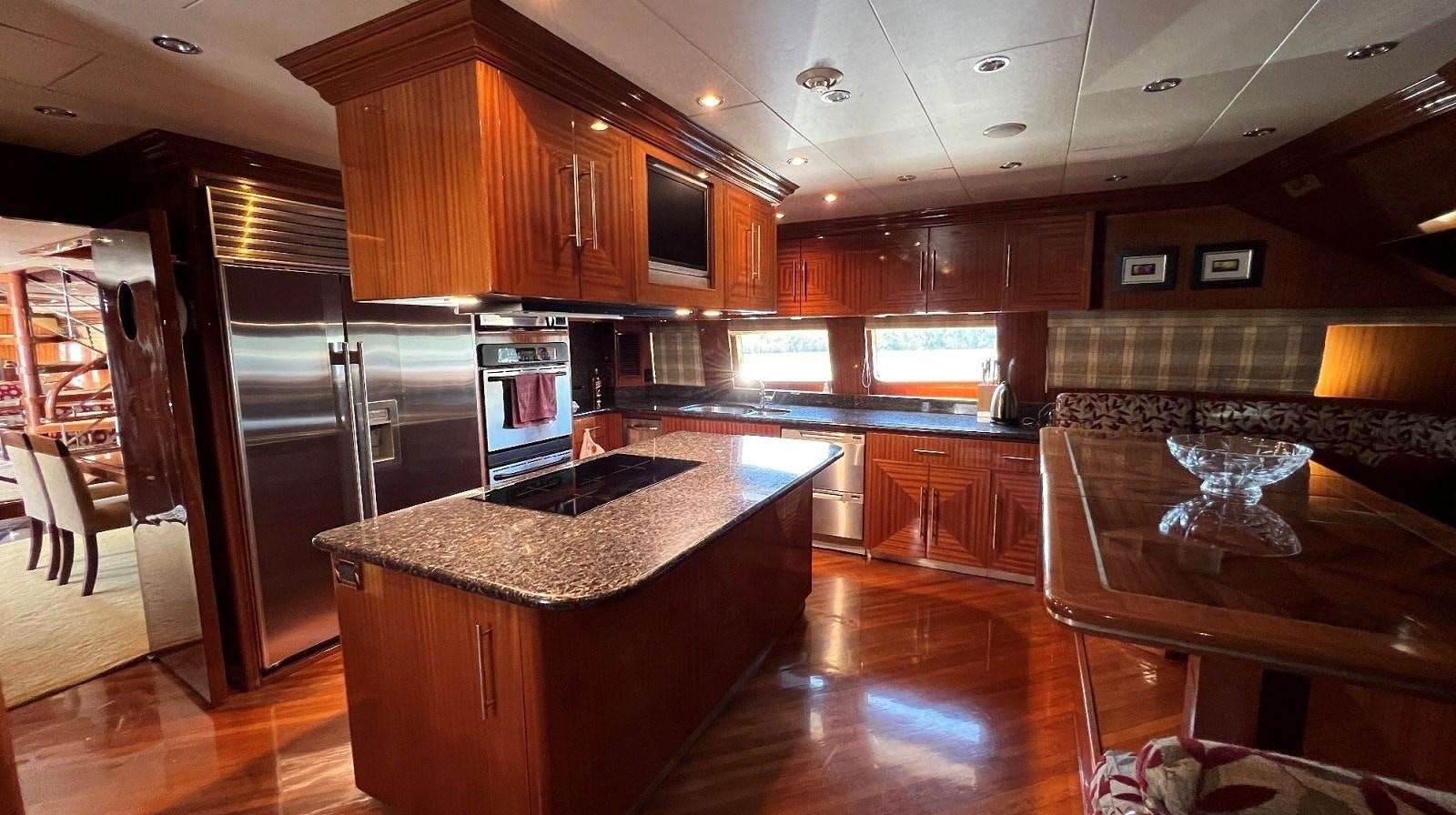 a kitchen with a large island aboard MISSY B II Yacht for Sale