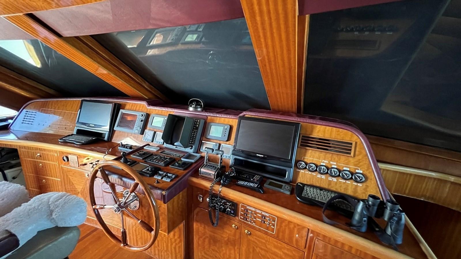 a control room with a radio and other electronics aboard MISSY B II Yacht for Sale