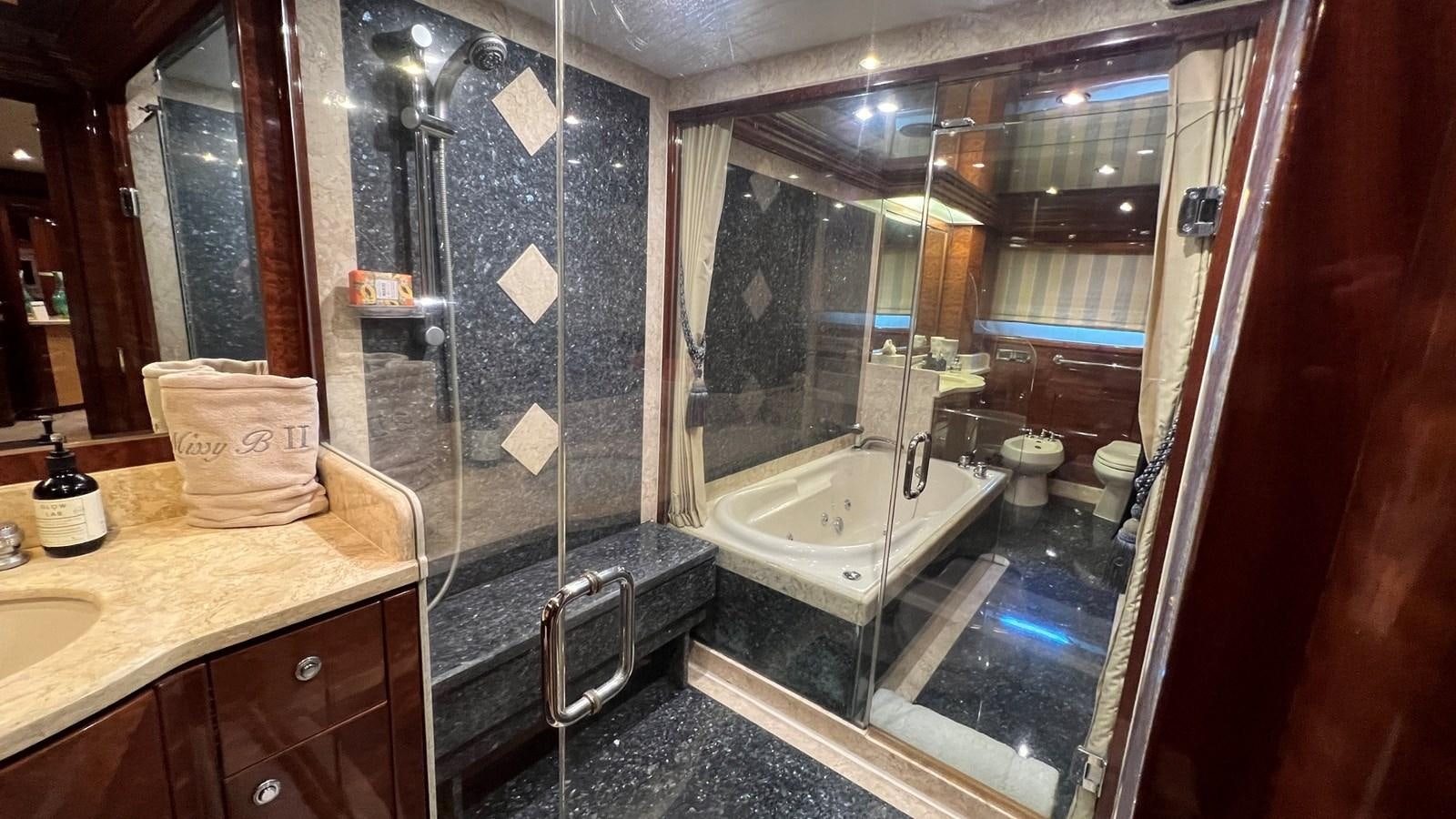 a bathroom with a large tub aboard MISSY B II Yacht for Sale