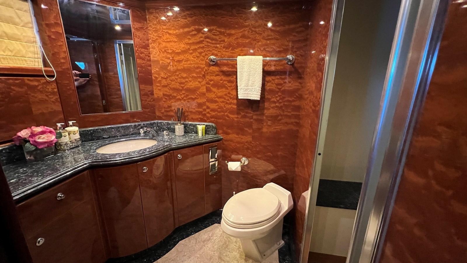 a bathroom with a sink and a toilet aboard MISSY B II Yacht for Sale