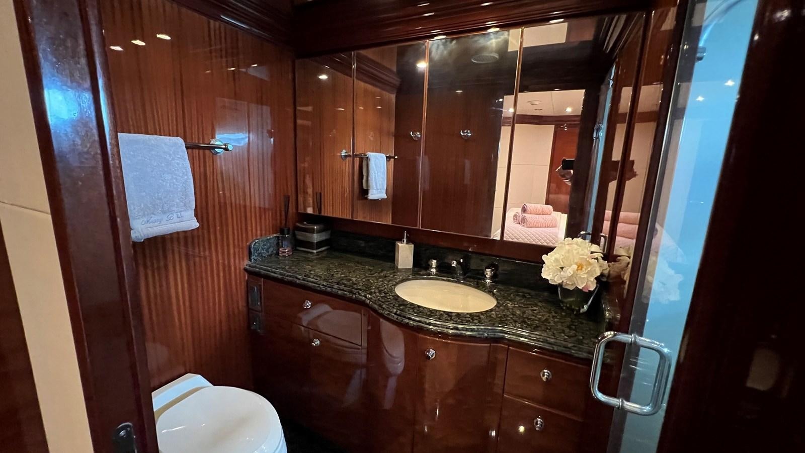 a bathroom with a large mirror aboard MISSY B II Yacht for Sale