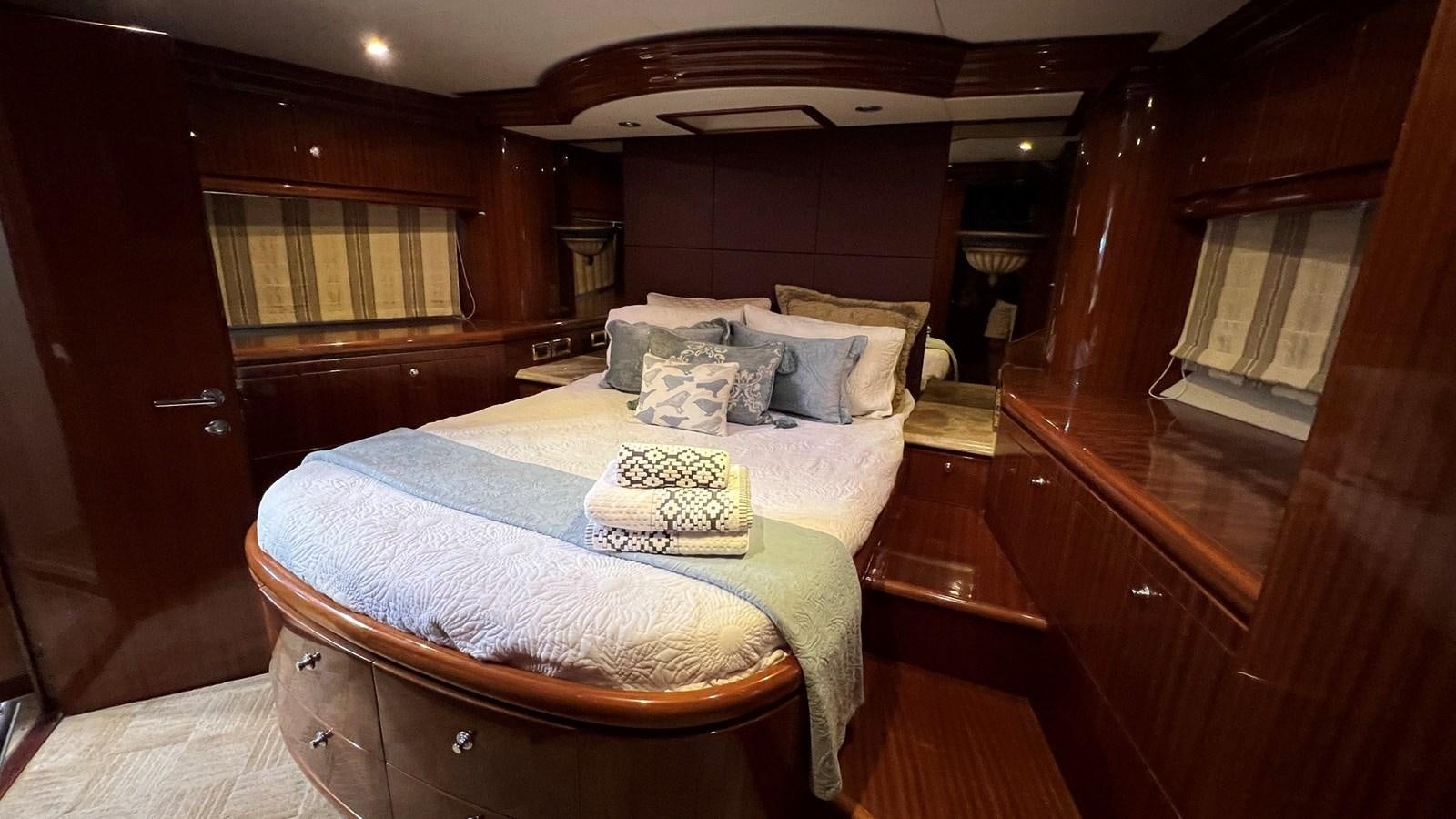 a bed in a room aboard MISSY B II Yacht for Sale