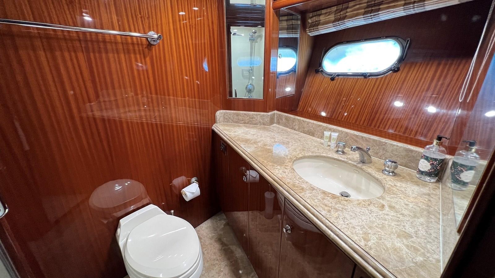 a bathroom with a sink and a toilet aboard MISSY B II Yacht for Sale