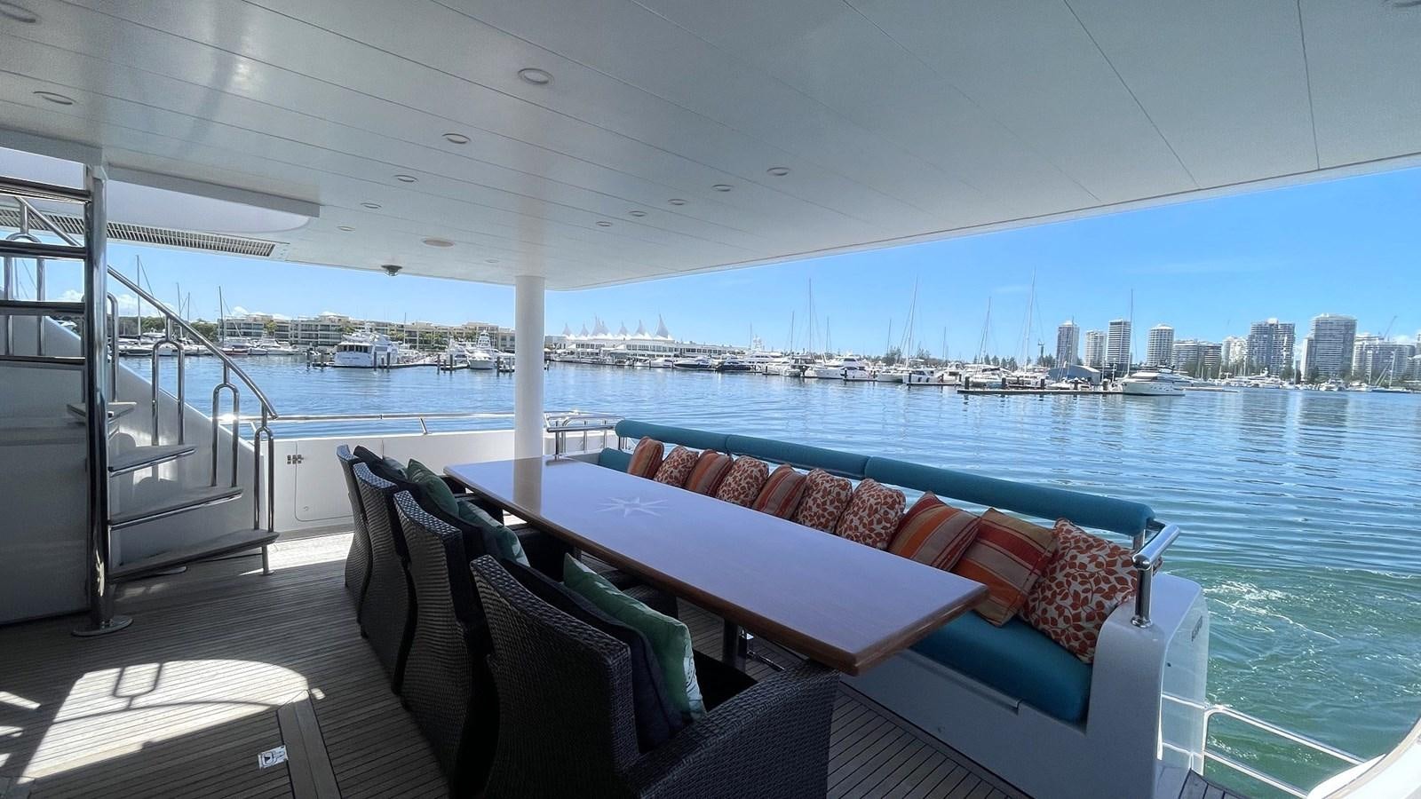 a couch and a table on a boat aboard MISSY B II Yacht for Sale