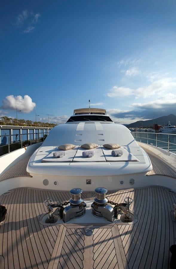 a white yacht on a deck aboard LADY MARIA Yacht for Sale