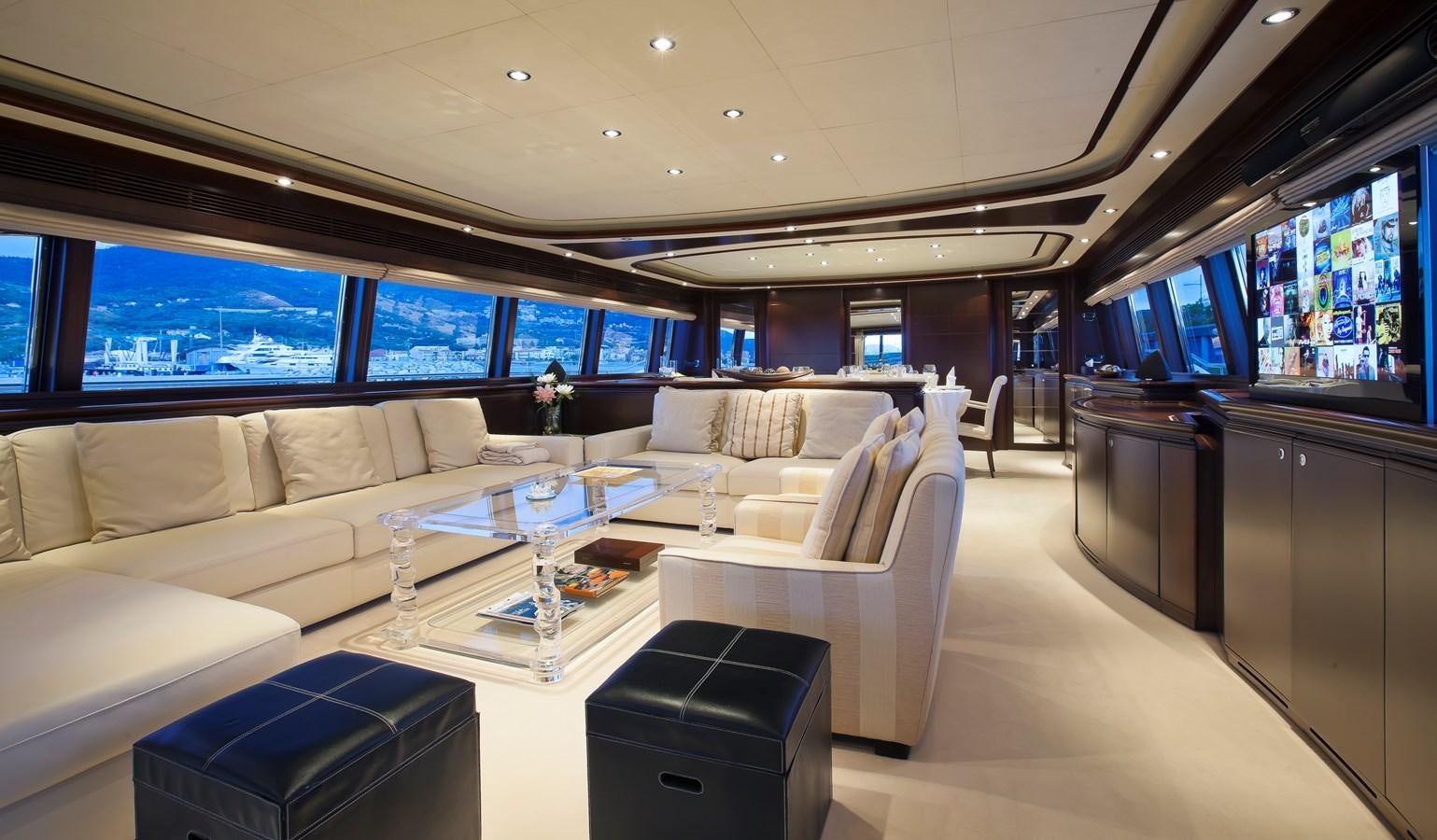 a room with couches and a table aboard LADY MARIA Yacht for Sale