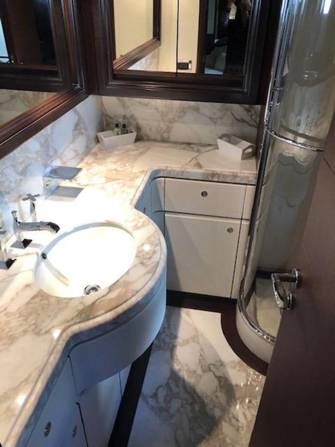 a bathroom with a sink and a mirror aboard LADY MARIA Yacht for Sale