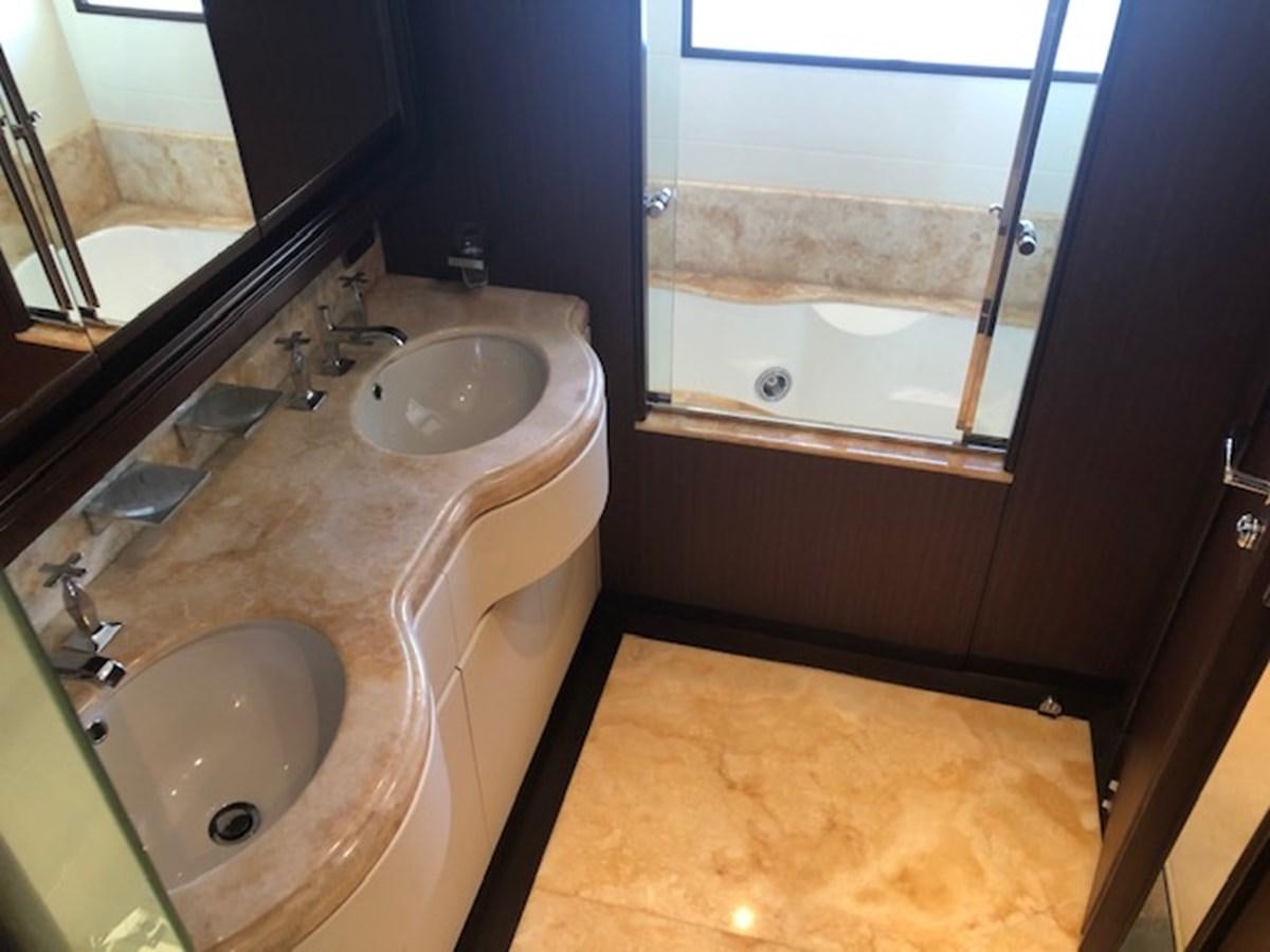 a bathroom with a sink and a bathtub aboard LADY MARIA Yacht for Sale