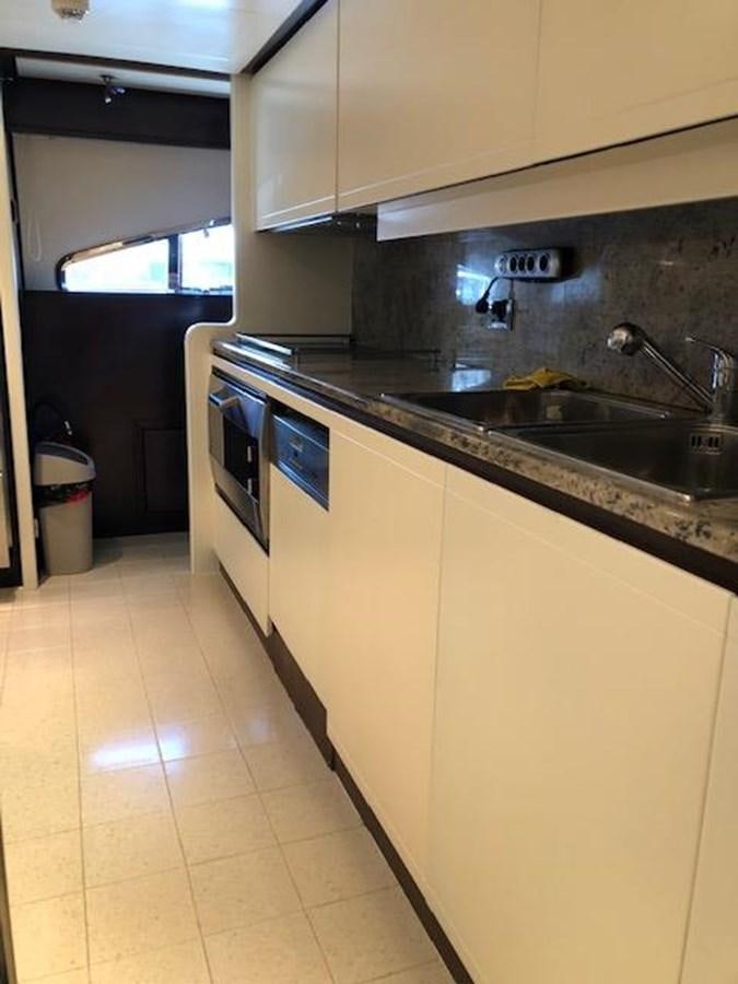 a kitchen with a sink and stove aboard LADY MARIA Yacht for Sale
