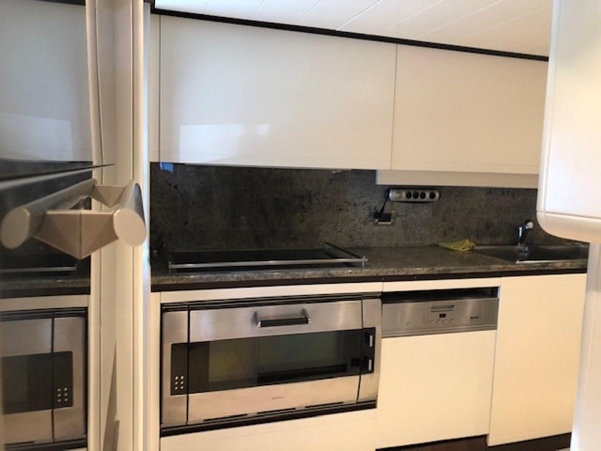 a kitchen with a stainless steel oven aboard LADY MARIA Yacht for Sale