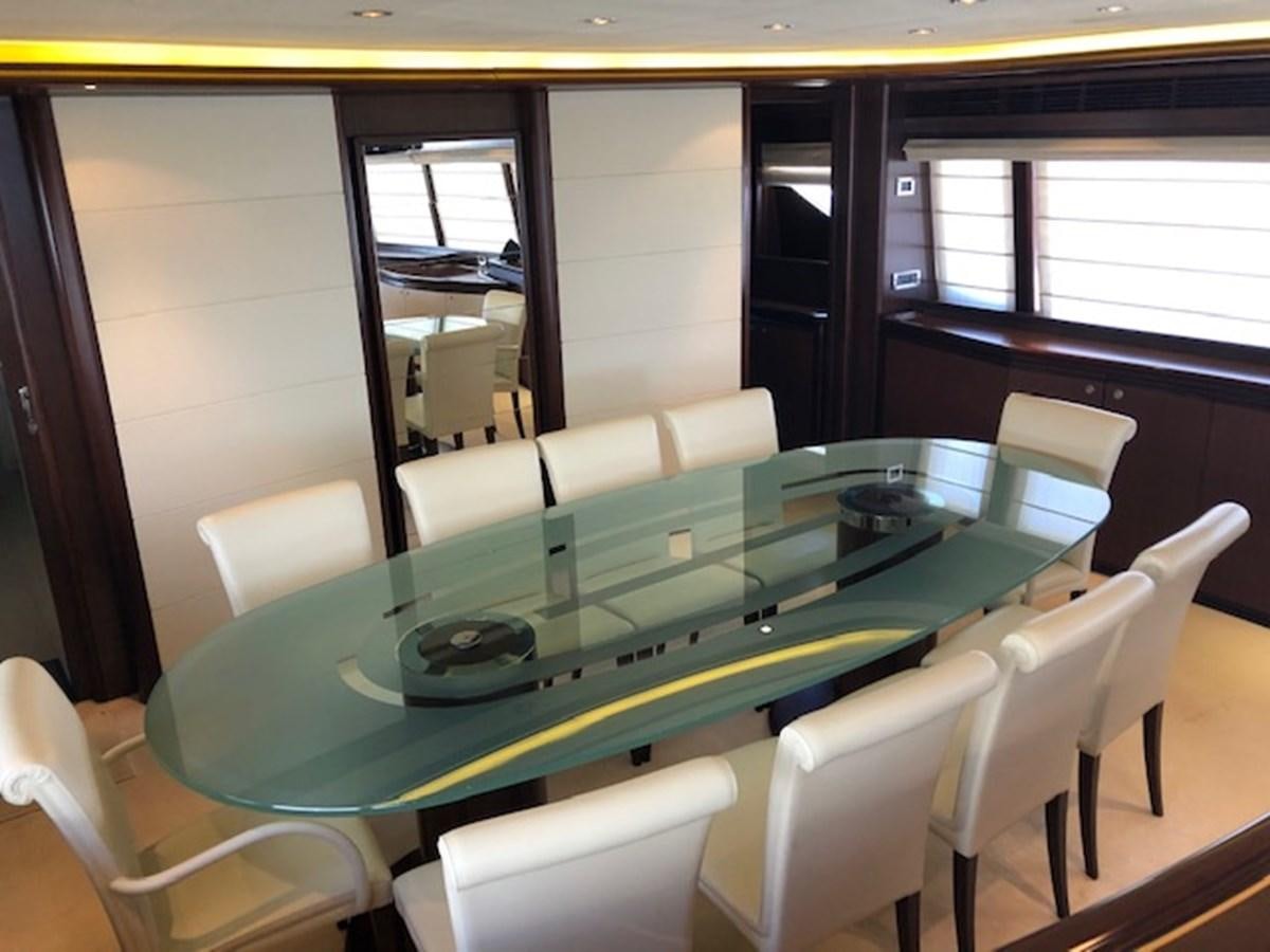 a table with chairs around it aboard LADY MARIA Yacht for Sale