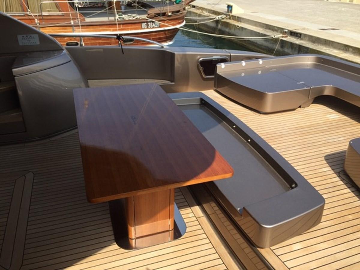 a wooden chair on a boat aboard LMPG Yacht for Sale
