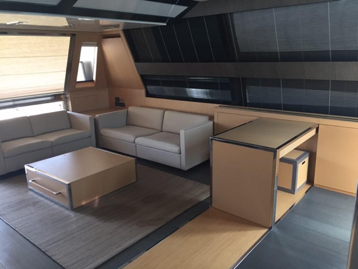 a room with couches and a table aboard LMPG Yacht for Sale