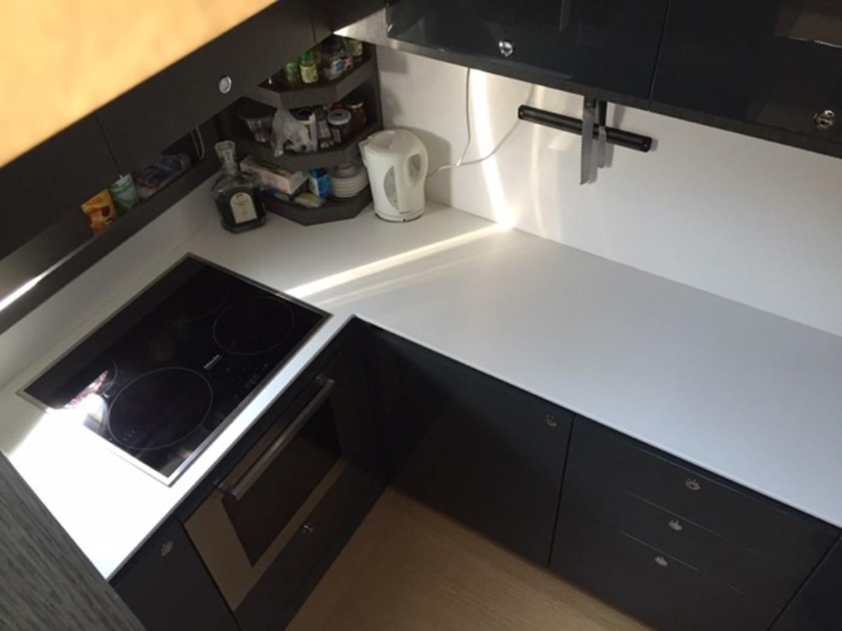 a kitchen with a stove and a coffee maker aboard LMPG Yacht for Sale