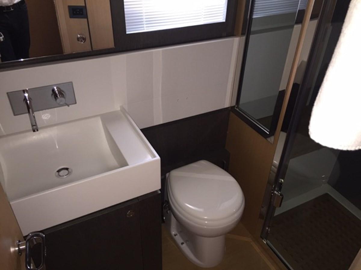 a bathroom with a sink toilet and a bathtub aboard LMPG Yacht for Sale