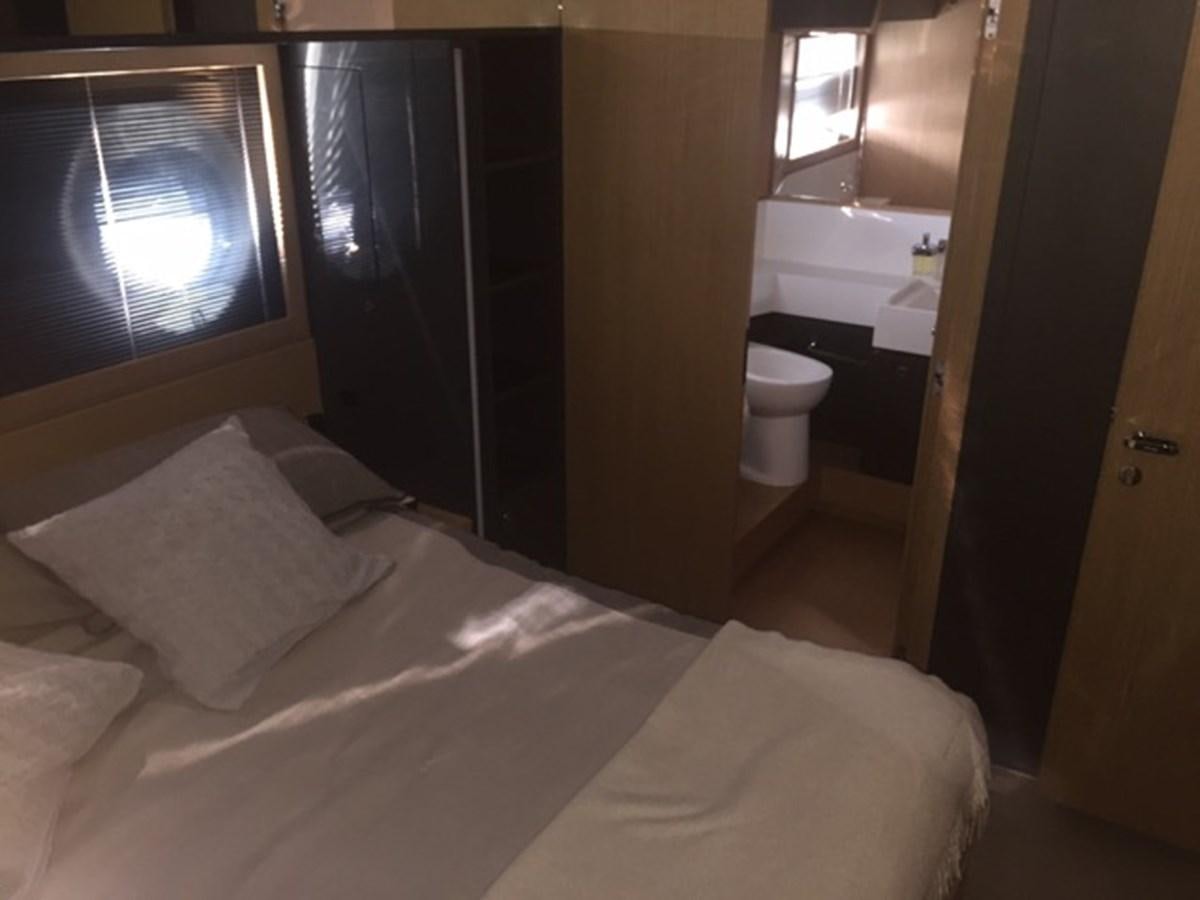 a bed in a room aboard LMPG Yacht for Sale
