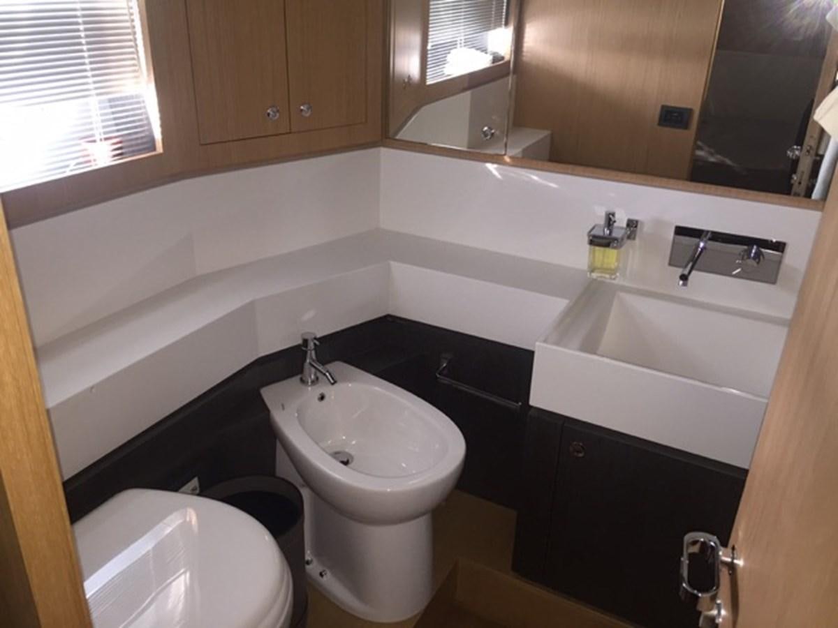 a bathroom with a sink and a toilet aboard LMPG Yacht for Sale