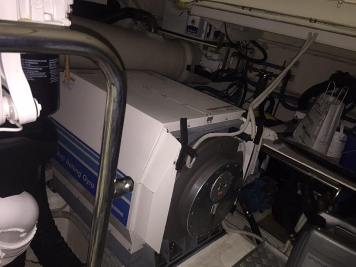 a car with a large wheel aboard LMPG Yacht for Sale