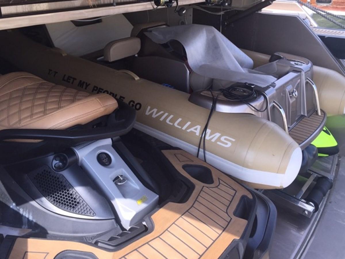 a car with a hood open aboard LMPG Yacht for Sale