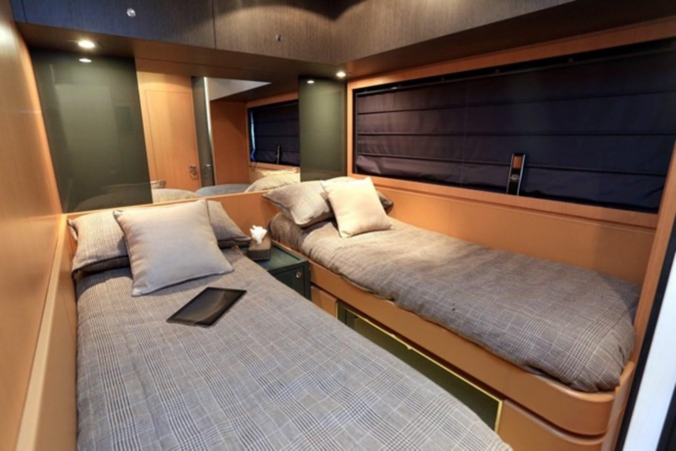 a bed with a tray on it aboard LMPG Yacht for Sale