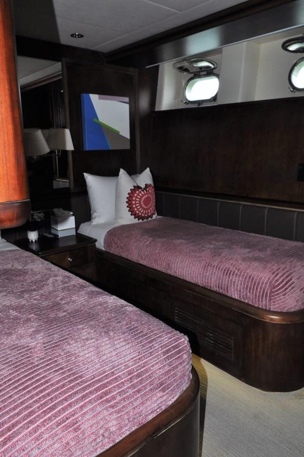 a couple of beds in a hotel room aboard TAKA TAKA III Yacht for Sale