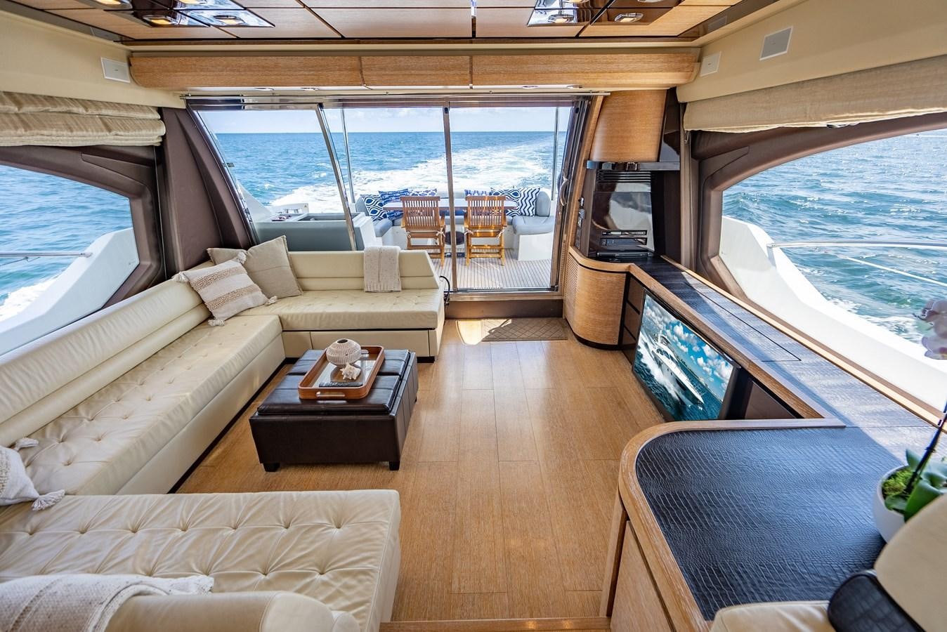 a living room with a large window aboard DAYS LIKE THIS Yacht for Sale
