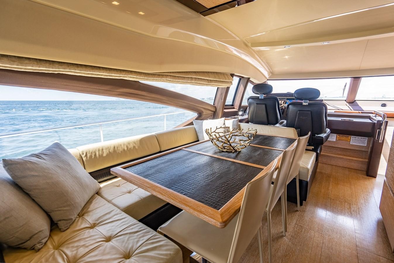 a room with a table and chairs aboard DAYS LIKE THIS Yacht for Sale