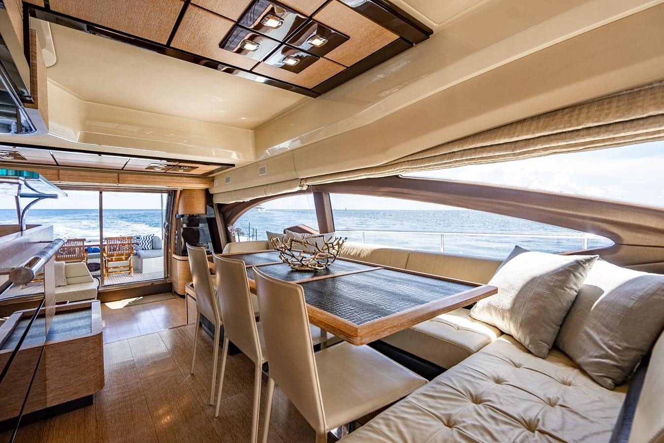 a room with a pool table and chairs aboard DAYS LIKE THIS Yacht for Sale