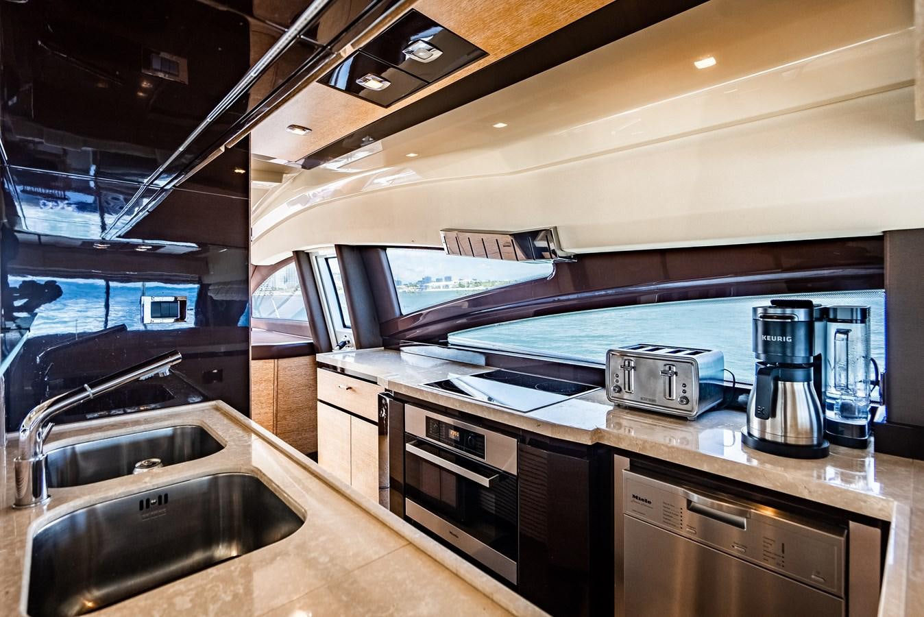 a kitchen with a sink and a microwave aboard DAYS LIKE THIS Yacht for Sale