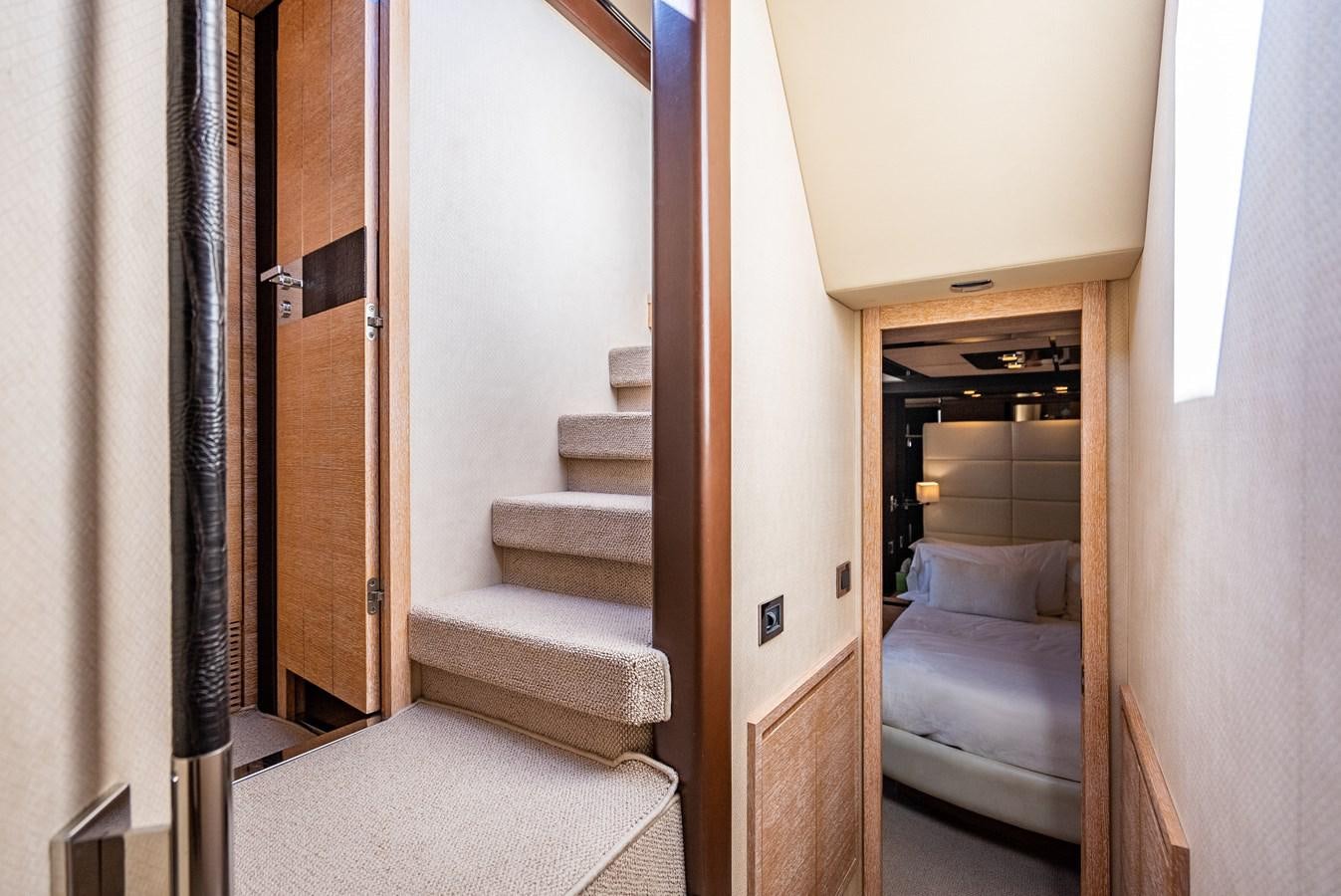 a hallway with a door and a bed aboard DAYS LIKE THIS Yacht for Sale