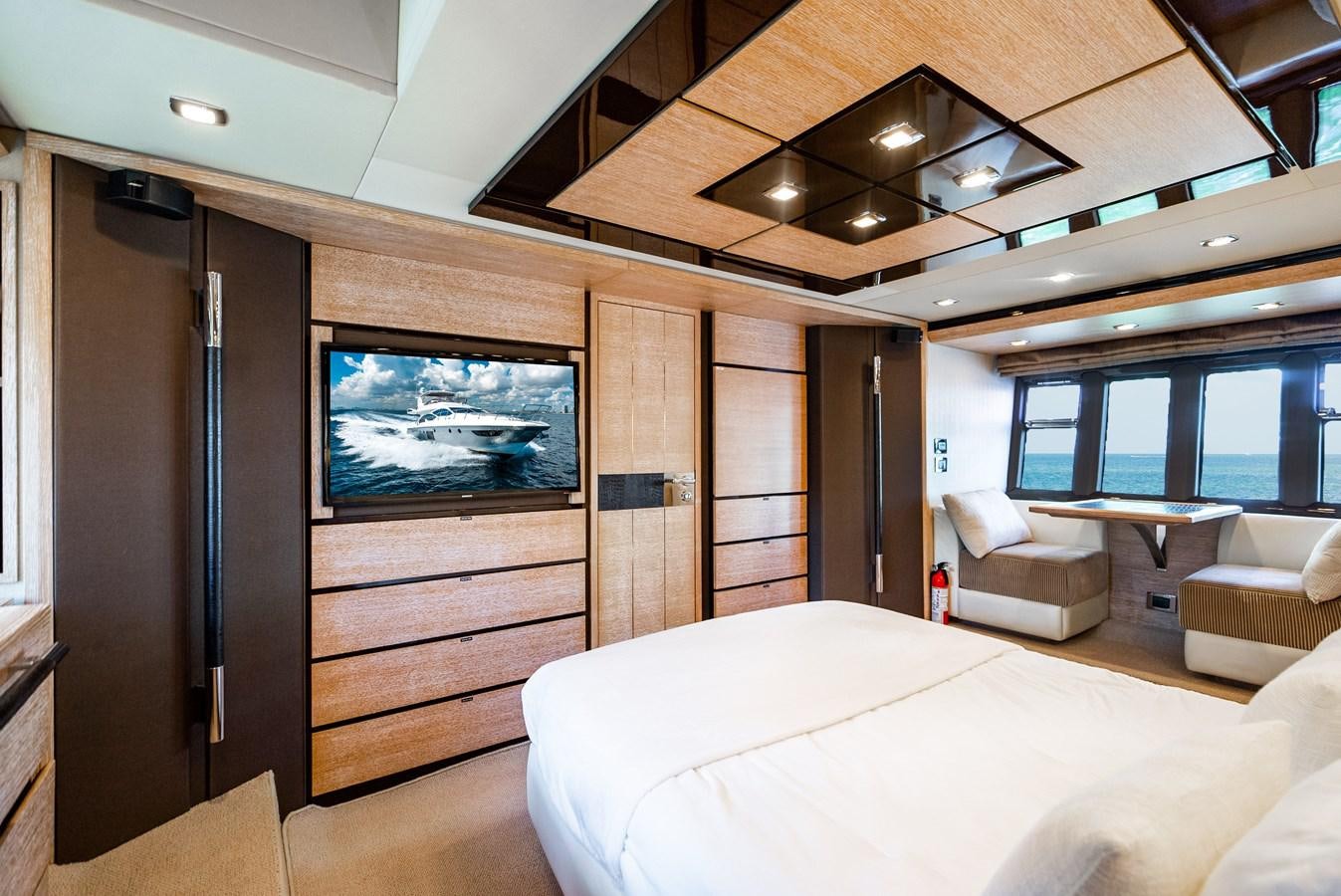 a room with a bed and a tv aboard DAYS LIKE THIS Yacht for Sale