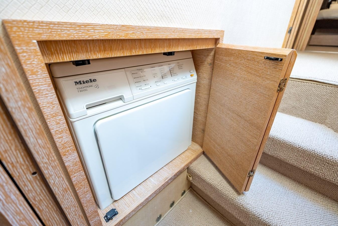 a white machine in a wooden box aboard DAYS LIKE THIS Yacht for Sale