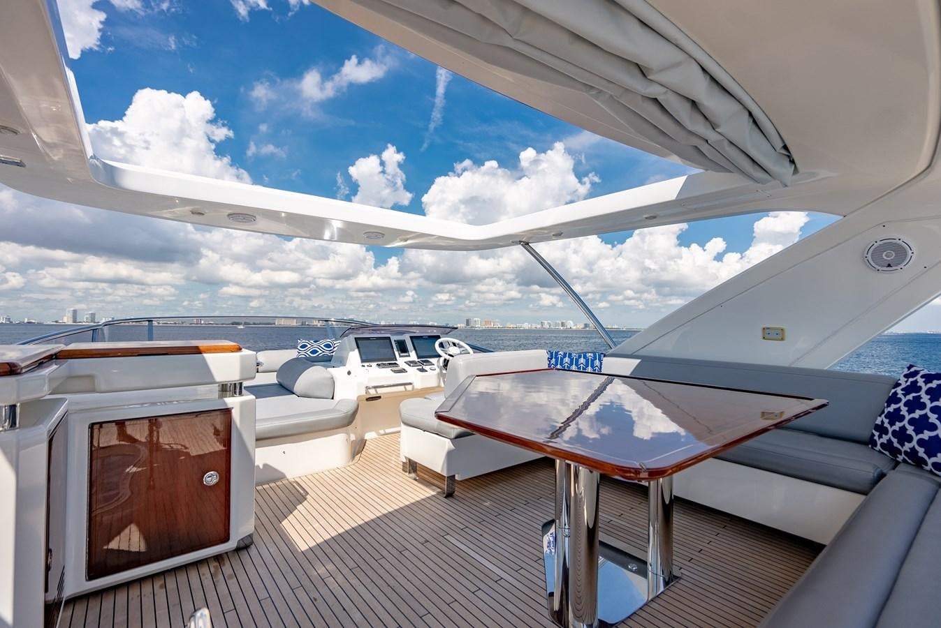 a deck with a pool and a boat on it aboard DAYS LIKE THIS Yacht for Sale