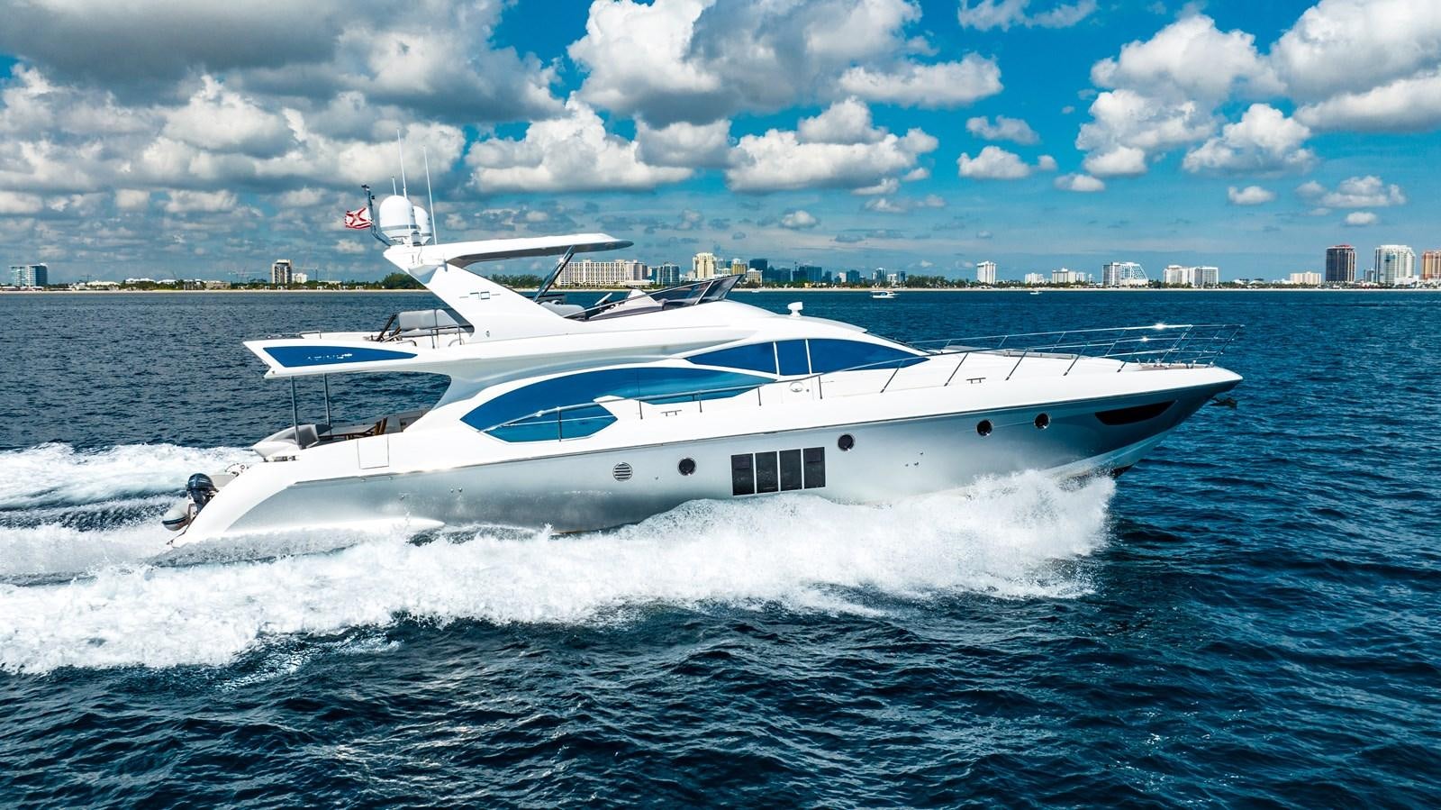 a white yacht in the water aboard DAYS LIKE THIS Yacht for Sale