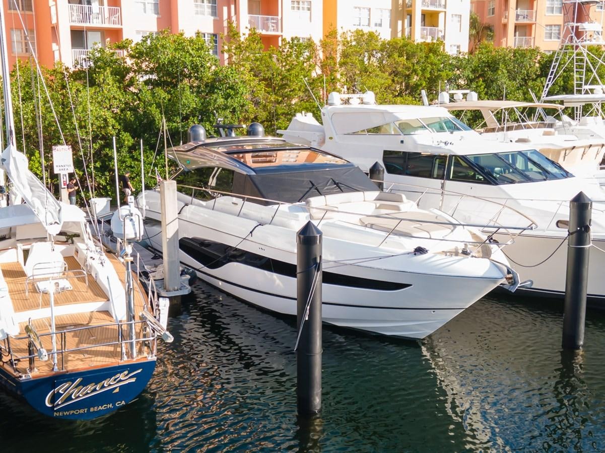 several boats docked at a pier aboard V65 PRINCESS Yacht for Sale
