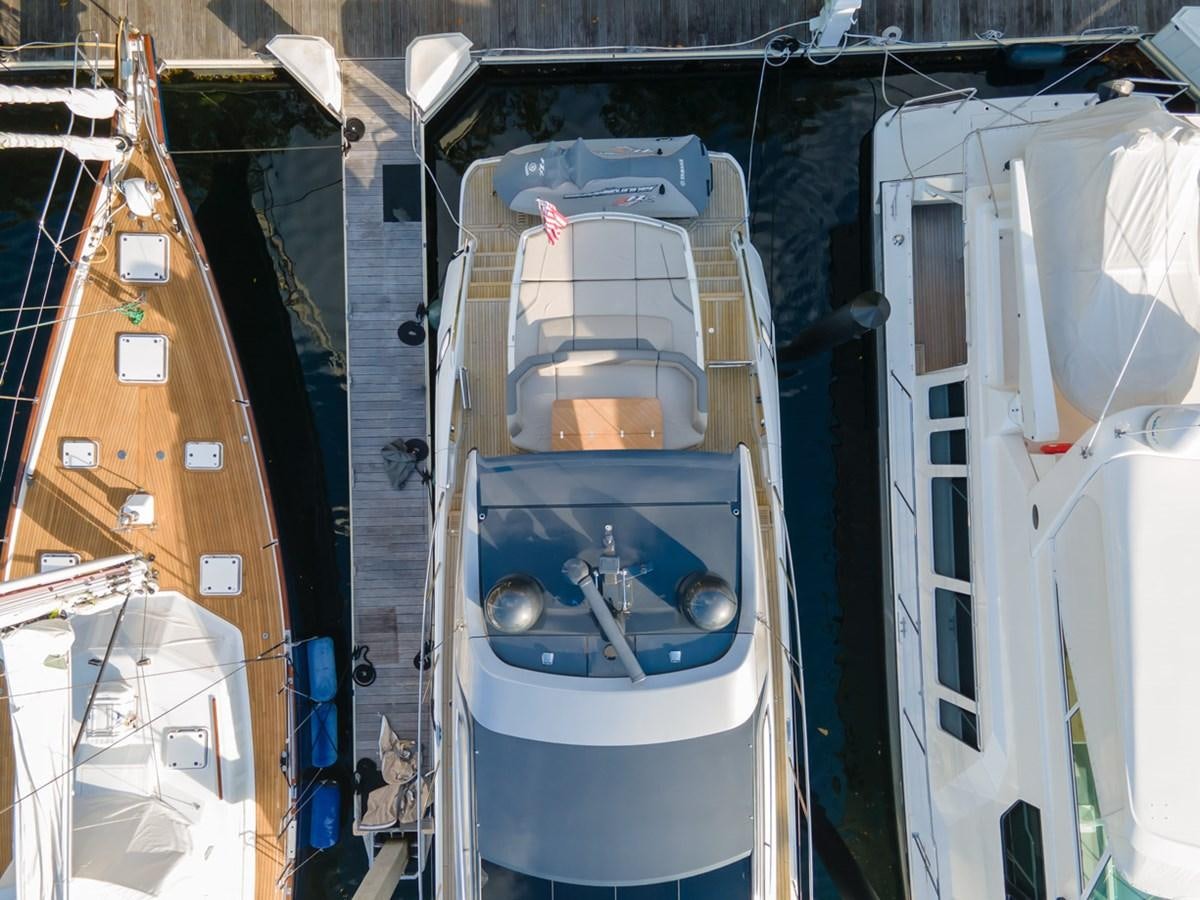 a large boat in a harbor aboard V65 PRINCESS Yacht for Sale