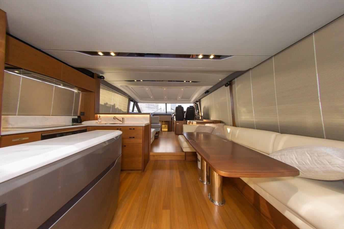 a room with a table and a bed aboard V65 PRINCESS Yacht for Sale